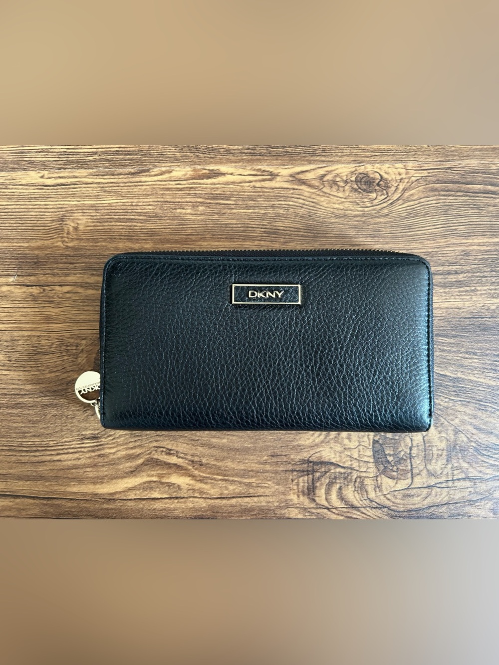 DKNY Black Leather Zip-Around Wallet with Gold Logo Plaque